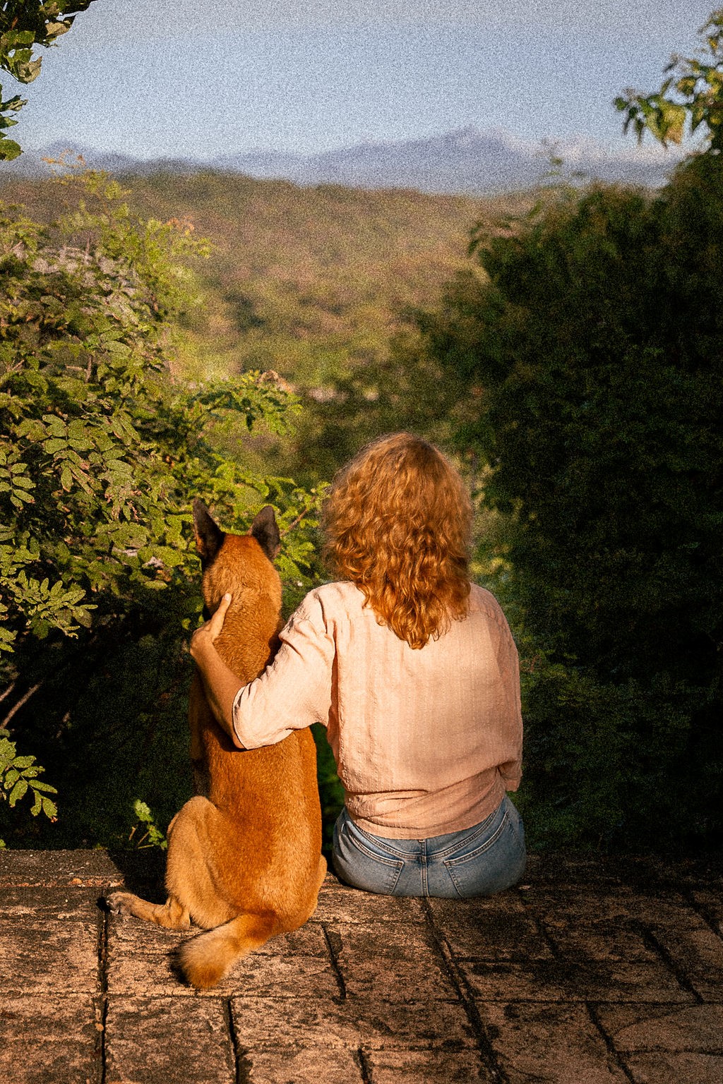Trainer and her dog Hidalgo watching the view together in Huatulco